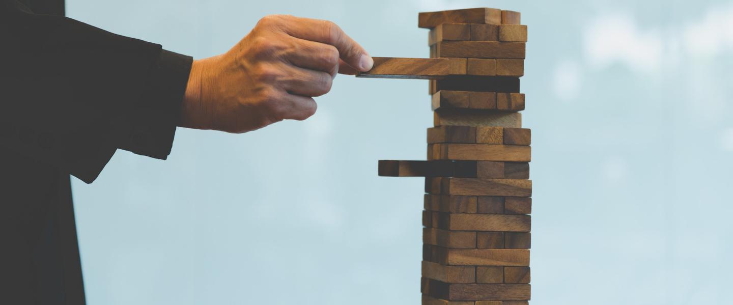 Jenga representing the ins and outs of Risk Management.