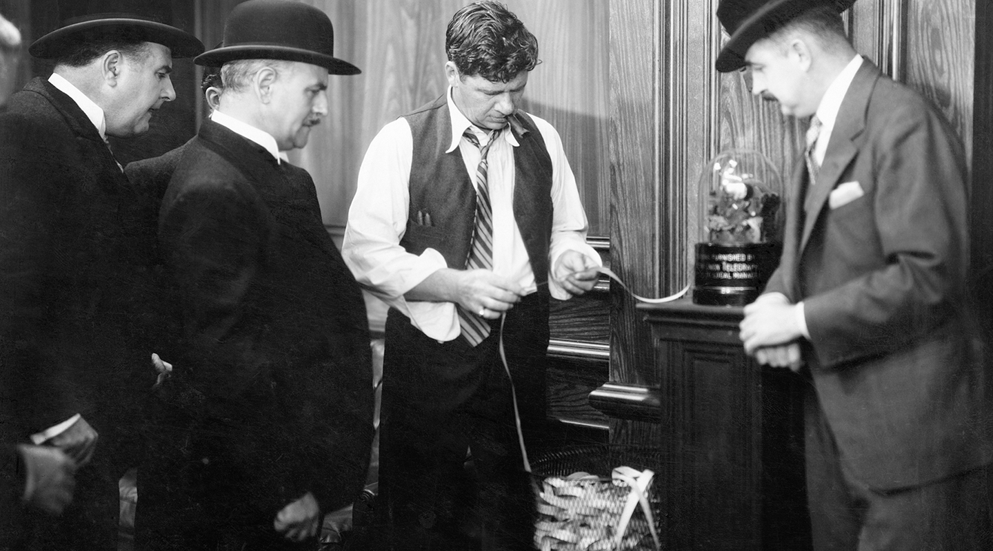 Traders searching through ticker tape feeds.